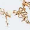 Naszyjnik typu choker „Abissi” z metalu i rafii, złoty Naszyjnik typu choker „Abissi” z metalu i rafii, złoty